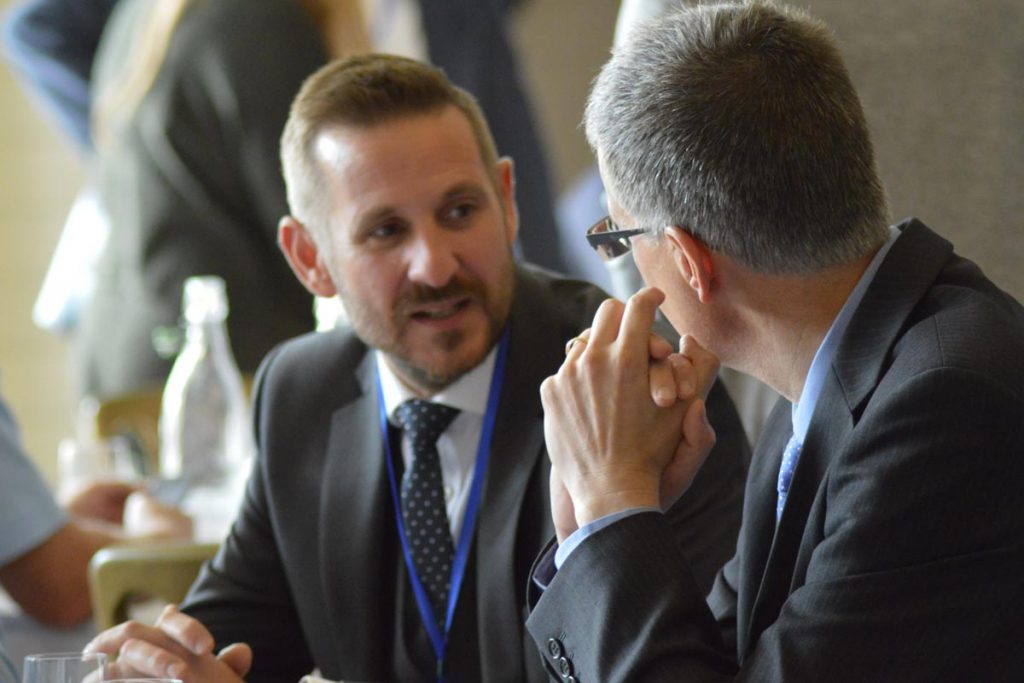 Business strategy meeting between two Inspire members